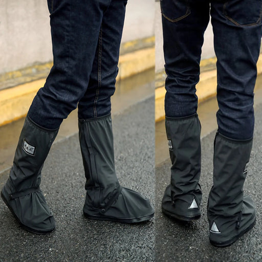 Waterproof shoe covers being worn over jeans on a wet pavement, showcasing full protection against rain.