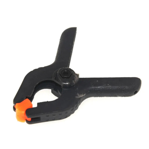 Black Plastic Clamps with orange tip.