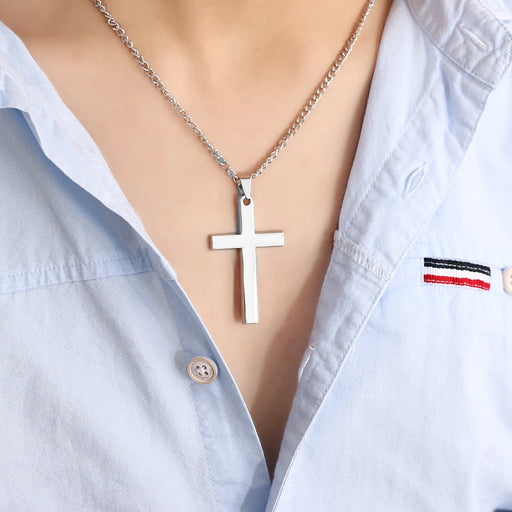 silver Cross Necklace on a person