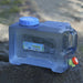 water container outdoors, covered in condensation, lying on a surface.