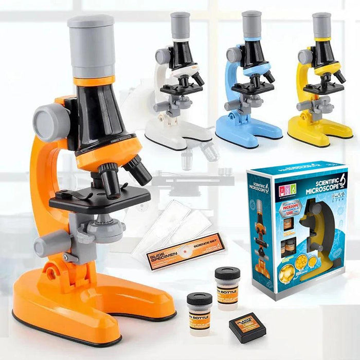 A collection of microscopes in various colors (orange, white, blue, yellow) along with a boxed set and sample bottles.