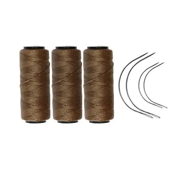 Three khaki rolls of sewing thread with four needles.