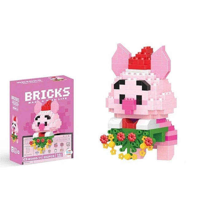 A single block-style toy figure of pink piggy, along with its pink packaging box. Display on white background.