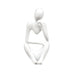 White minimalist abstract sculpture of a figure sitting with one hand resting on the chin.