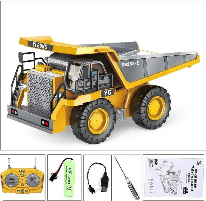 Yellow toy dump truck with remote control and accessories.