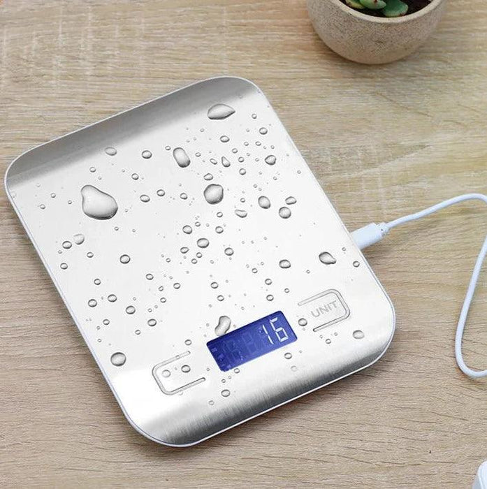 Water-resistant stainless steel kitchen scale with droplets of water on the surface, demonstrating durability.