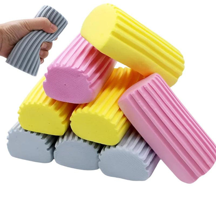 A stack of colorful, ribbed cleaning sponges in pink, yellow, and gray.