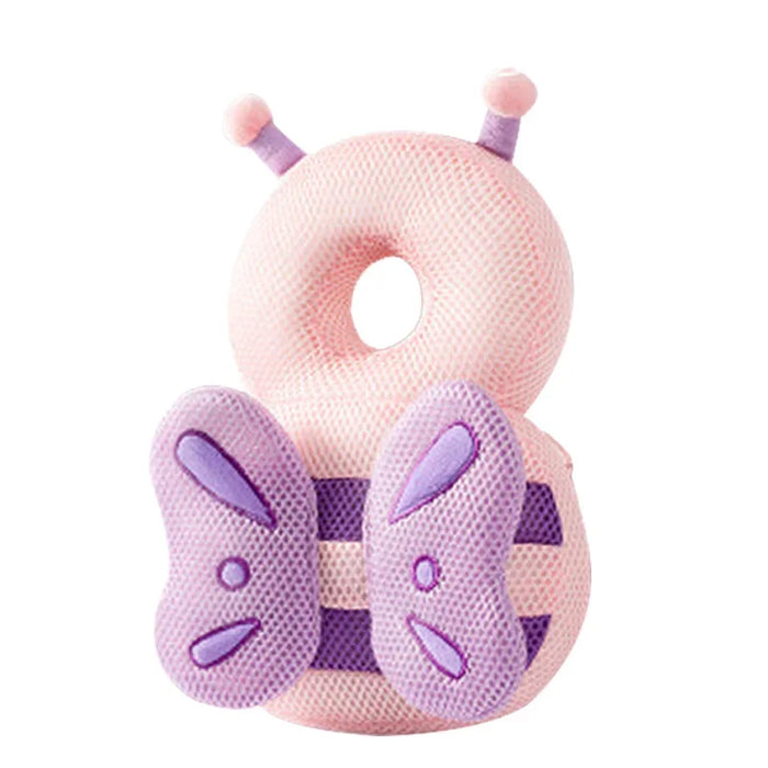 A pink butterfly-shaped baby head protector with purple wings and antennae, designed to protect the baby's head.