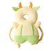 A soft, cow-shaped baby head protector with a beige body, green ears, and orange horns.