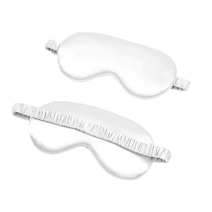 White sleep eye mask shown from front and back.