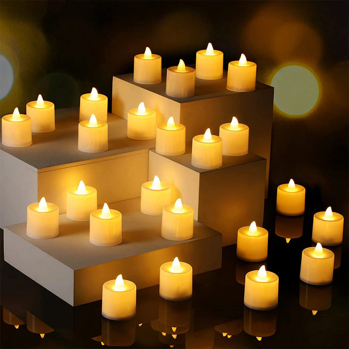 An array of white LED tea light candles arranged on tiered stands. The candles emit a soft yellow glow, creating a serene and elegant display suitable for various decorative settings.