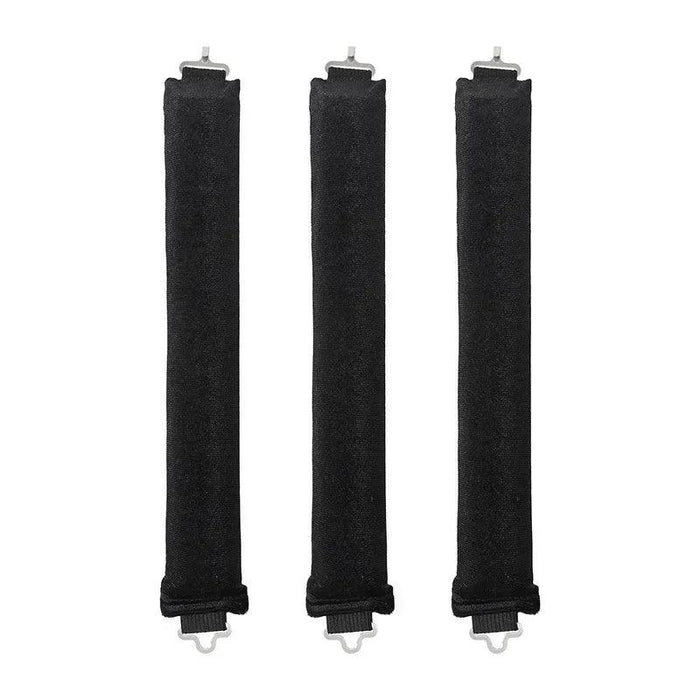 Black brown rod-shaped hair curlers in a row.