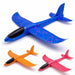 three assembled foam gliders in blue, orange, and red. Each glider has a black nose, and the vibrant colors with speckles give them a playful, eye-catching appearance.