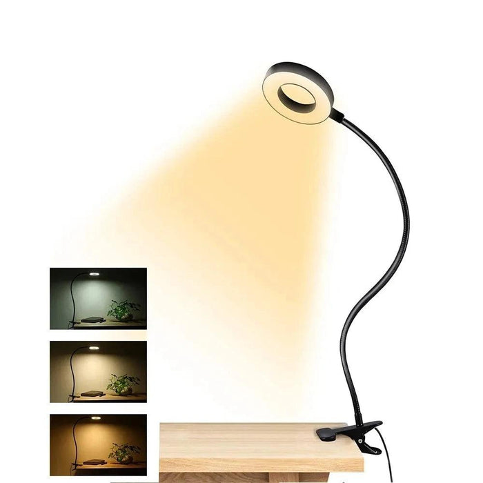 A flexible LED ring light clamped to the edge of a desk, projecting warm light. Inset images on the left illustrate the light's various color temperatures and how it looks in different settings, from cool to warm tones.