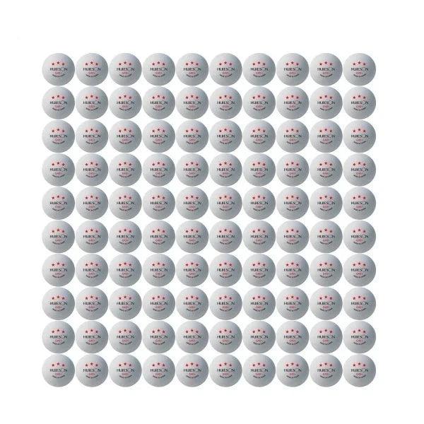 One hundred white Huieson G40+ table tennis balls arranged in a grid, each with three red stars and "Made in China" text.