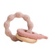 A pink silicone teether ring with various textured patterns and a wooden ring attached to it.