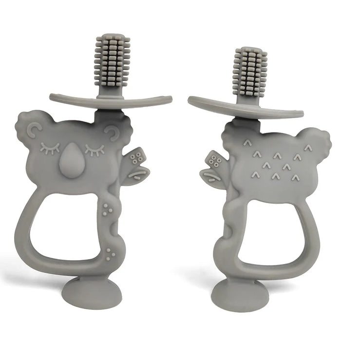 Two gray silicone teethers shaped like koalas with built-in toothbrush bristles on top.