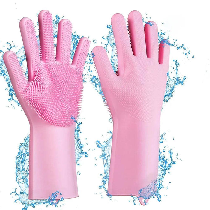 A pair of pink silicone cleaning gloves with rubber bristles on the palms and fingers. Water splashes are added to the background to emphasize the gloves' waterproof nature.