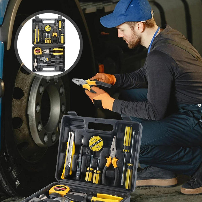 a man working on a vehicle wheel with a set of tools. The toolset, prominently displayed in an inset, includes a variety of hand tools organized in a black plastic carrying case. The man is using a pair of pliers from the set, emphasizing the practical application of the tools.