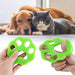 two green pet hair removers held in hands, with a dog and a cat lying contentedly in the background.