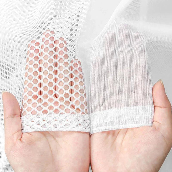 Close-up of a white mesh laundry bag on a hand, showcasing its difference between the two bag. Those meshes is designed to protect delicate garments during washing.