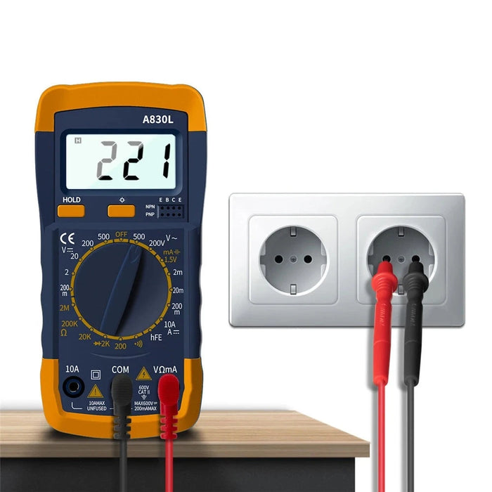 A digital multimeter (model A830L) connected to a wall outlet, displaying a reading of 221 volts with red and black test probes inserted into the socket.