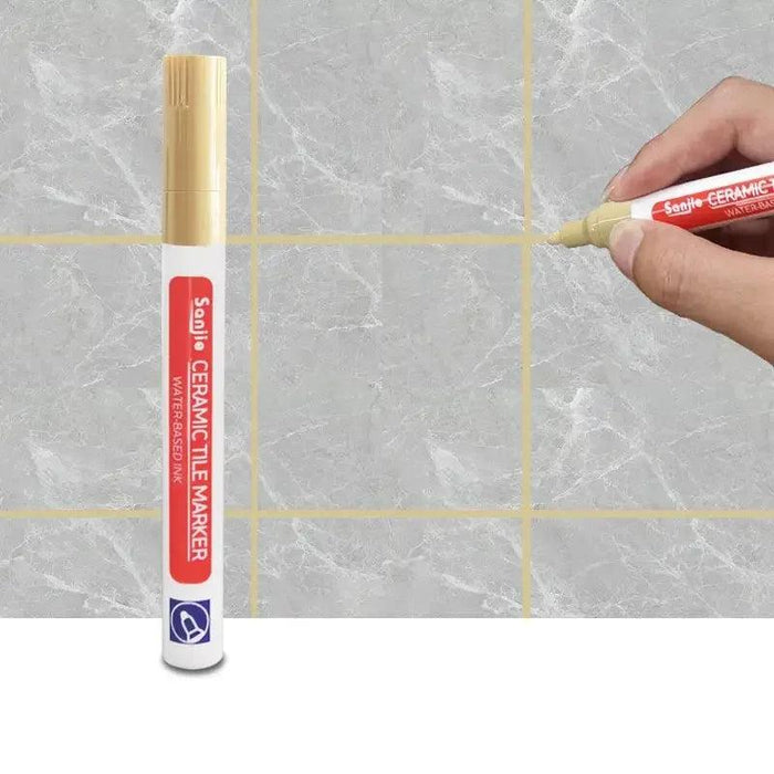 A khaki ceramic tile marker in use on a marble-like tile surface, clearly defining grout lines for a polished and clean finish.