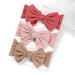 A set of 3 Baby Bow Headbands with different colors.