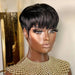 A mannequin with a short black wig styled in a sleek, straight pixie cut, shown against a room background.