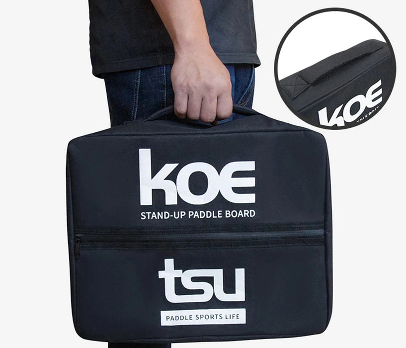 A close-up of the black storage bag with the "KOE" and "TSU" logos, being carried by hand.