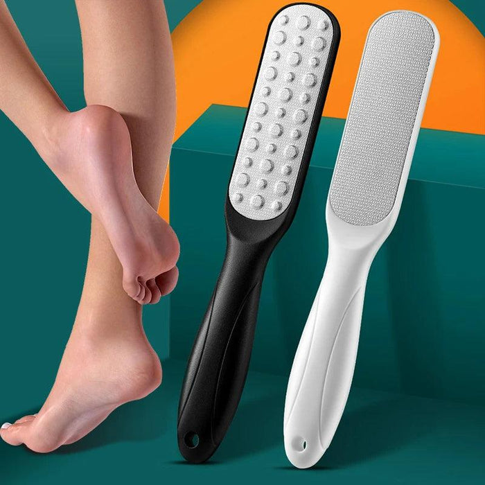 Two foot files, one black and one white, are displayed alongside an image of smooth, freshly treated feet. The textured surfaces of the files are shown in detail, highlighting their effectiveness for removing calluses and smoothing skin. Displayed on green and orange background.