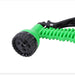 A side view of the green garden hose nozzle, highlighting its ergonomic design and spray settings.