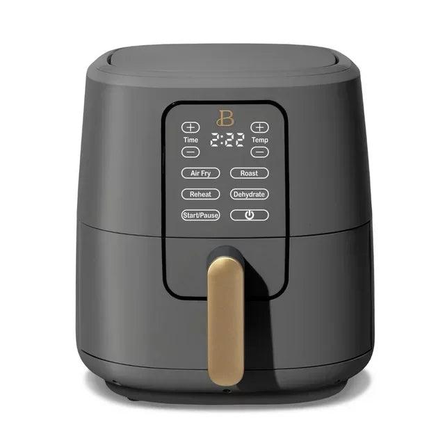 A sleek gray air fryer with a gold handle, featuring a digital display and various cooking options.