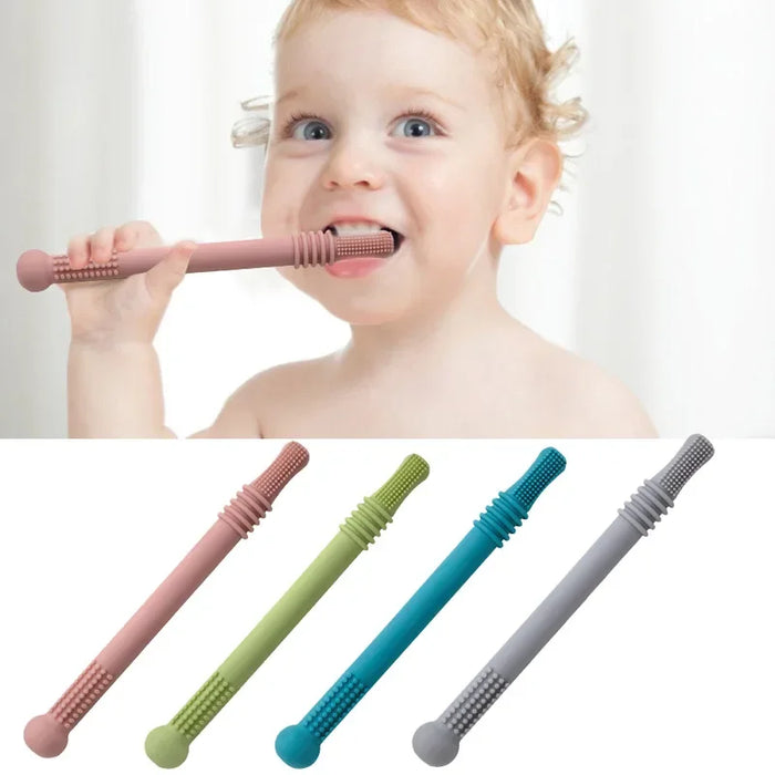 A toddler with light hair is shown chewing on a pink silicone teething stick. Below are four silicone teething sticks in pink, green, blue, and gray.