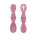 A close-up of two purple baby spoons, one with a regular spoon shape and the other with a cut-out flower design, against a white background.