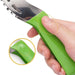 The watermelon slicer with a green handle is shown in a hand, highlighting the ergonomic design and comfortable grip.