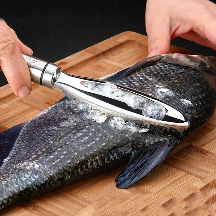 fish scaler in action, being used to remove scales from a fish on a wooden cutting board.