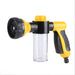 A yellow and black hose nozzle with a clear soap dispenser, displayed on a white background.