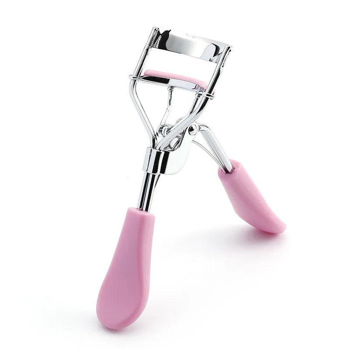 Silver Eyelash Curler With Pink Handles.