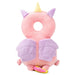  A pink unicorn-shaped baby head protector with purple wings and a yellow horn, designed for baby safety.