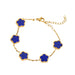 A gold bracelet, designed with a flower-shaped pendant with a blue center.