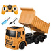 Yellow toy dump truck with remote control and accessories.