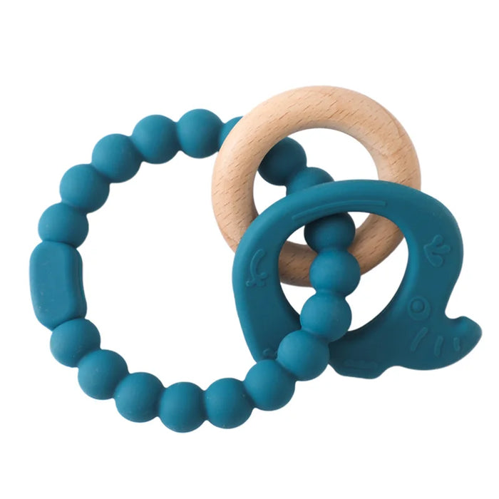 A teething ring set with blue silicone beads, a wooden ring, and a blue silicone elephant-shaped charm.