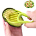 A person using a green avocado slicer to slice an avocado.