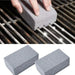 A hand scrubs a dirty metal grill grate with a gray pumice stone, which is cleaning and polishing the metal to a shiny finish. Below, two gray pumice stones are shown side by side.