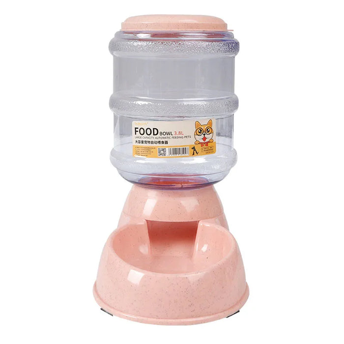 An automatic pet food dispenser with a large clear food container labeled "FOOD Bowl 3.8L". The container is mounted on a light pink base that has a built-in food bowl.