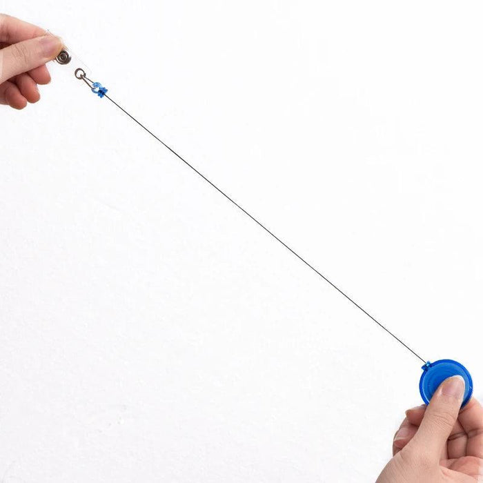 Hands pulling the retractable cord of a blue badge reel extended.