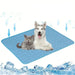 Cooling Pet Mat with Dog and Cat: The image shows a blue cooling mat with a happy dog and a relaxed cat lying on it. The mat is designed to keep pets cool, indicated by snowflake icons and downward arrows representing the cooling effect.