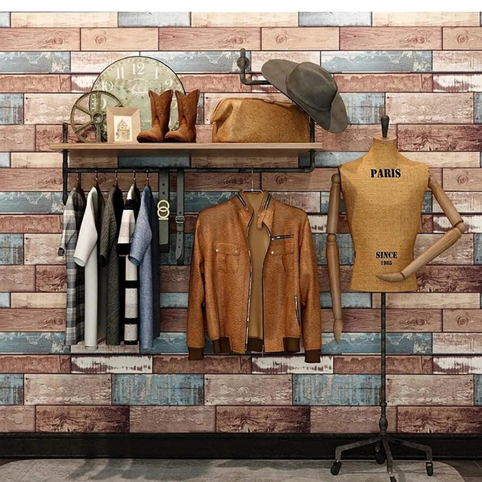 A wall with a distressed, multicolored wood plank design, featuring a shelf with clothes, boots, and a mannequin.