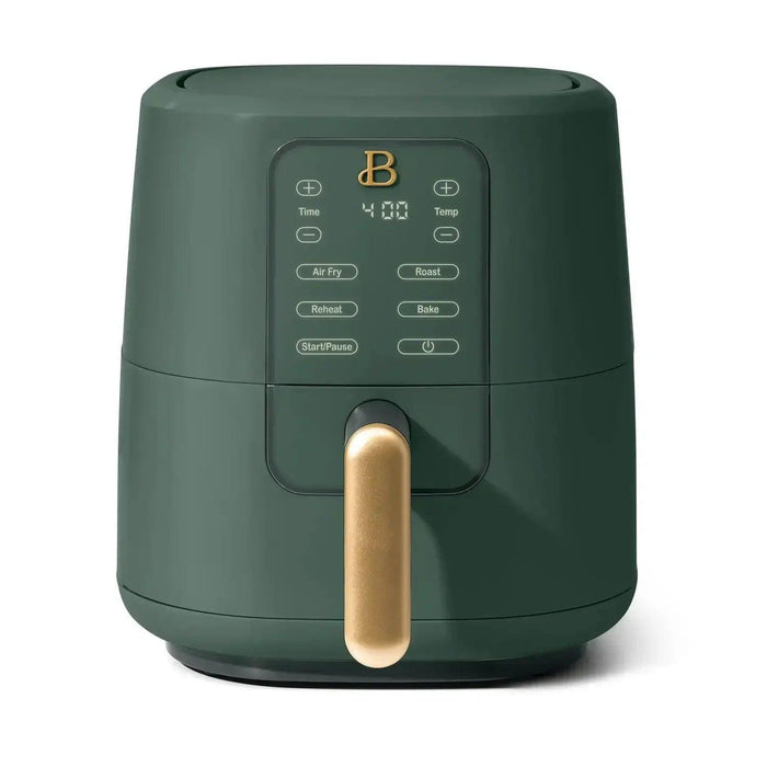 A sleek dark green air fryer with a gold handle, featuring a digital display and various cooking options.